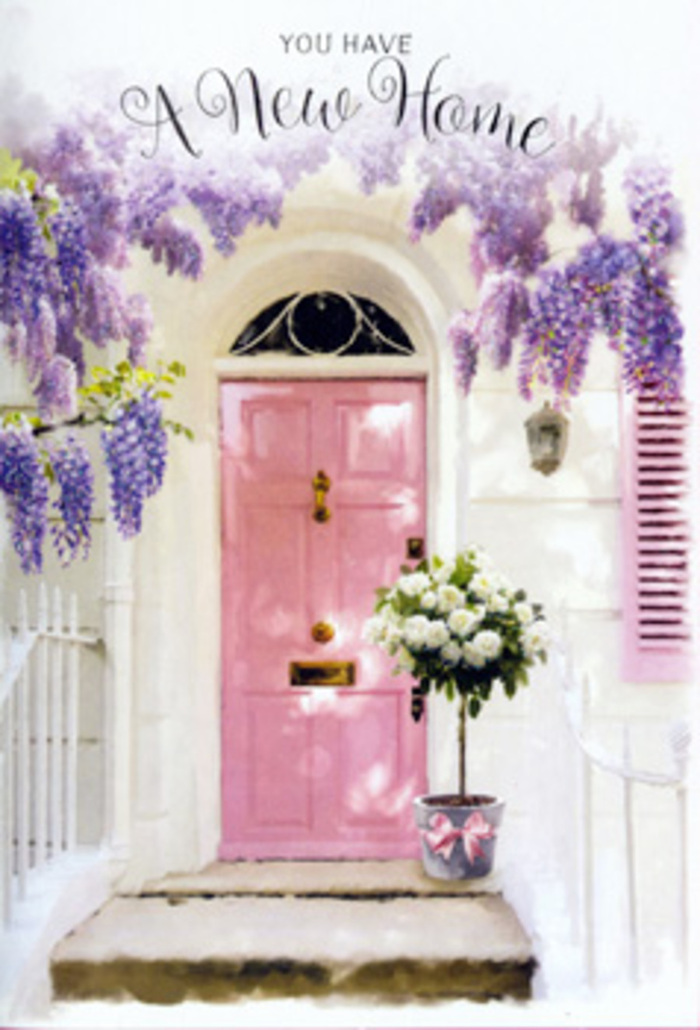 Framed by cascades of wisteria, this pastel-perfect doorway could sit comfortably along a leafy road in Cheshunt, capturing the feeling of a first day in a new home. The door is painted a subdued, chalk-pink, its finish matte and quietly elegant, glowing against the crisp white of the surrounding wall. A single shutter, washed in a similar blush tone, balances the composition, lending a hint of rustic charm that softens the neat, urban lines. From above, wisteria vines trail downward in long, delicate clusters of lilac and lavender flowers, their slender petals forming a soft veil that partially shades the entrance. The greenery of the vines is sparse enough to let the light in, creating dapples that skim across the step and cast faint, shifting shadows on the door panels. Resting on the doorstep is a tall, cylindrical tin bucket in muted grey, its surface slightly weathered, suggesting practicality elevated by a florist's touch. The bucket is filled to the brim with creamy ivory and white roses, arranged in a generous, rounded mass. Some blooms are lush and fully open, their petals curling outwards to reveal layered hearts, while others remain gently cupped, giving the arrangement a sense of movement and life. Sprays of soft, sage-toned foliage peek between the blooms and overflow the rim with natural ease. Around the base of the bucket, a pale pink ribbon is tied in a loose, sumptuous bow, its satin sheen catching small highlights of light. The entire scene feels like a quiet blessing for a new Cheshunt household, the sort of thoughtful delivery that greets you when you first arrive with keys in hand, turning a simple doorway into an instant symbol of comfort, hope, and belonging.